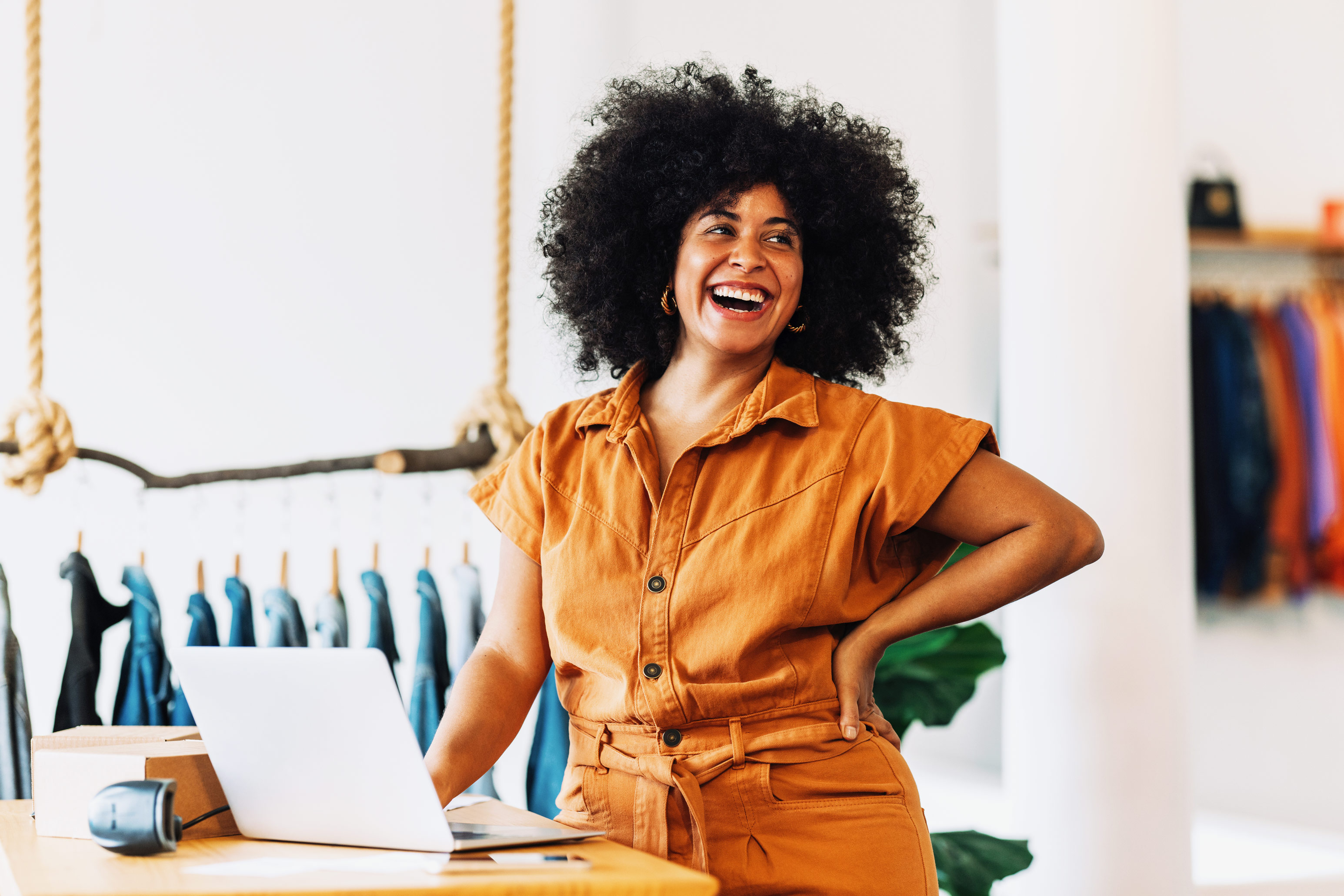 Woman smiling in orange outfit
